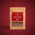 A 250g stand-up pouch of Rooibos Espresso tea from the brand Tea by the Sea, featuring a brown kraft paper bag with a red label and a clear window showing the loose-leaf tea inside.