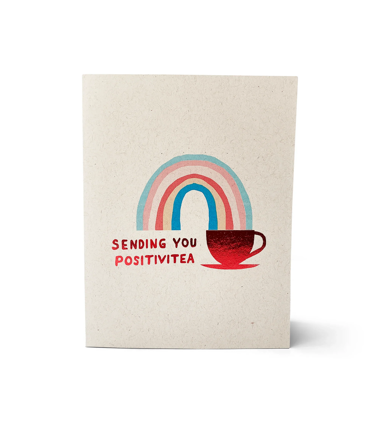 Greeting card with colorful rainbow and red tea cup illustration reading 'Sending you Positivitea' on natural paper
